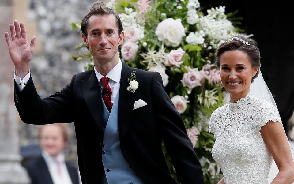 Pippa Middleton, right, and James Matthews smile after their wedding at St Mark's Church in Englefield - AP POOL