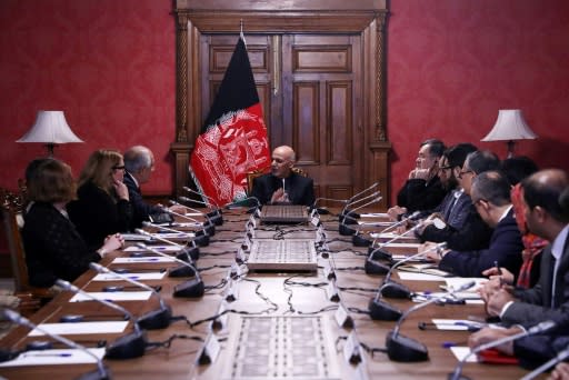Afghan President Ashraf Ghani (C) met US envoy Zalmay Khalilzad (top L) in Kabul in January