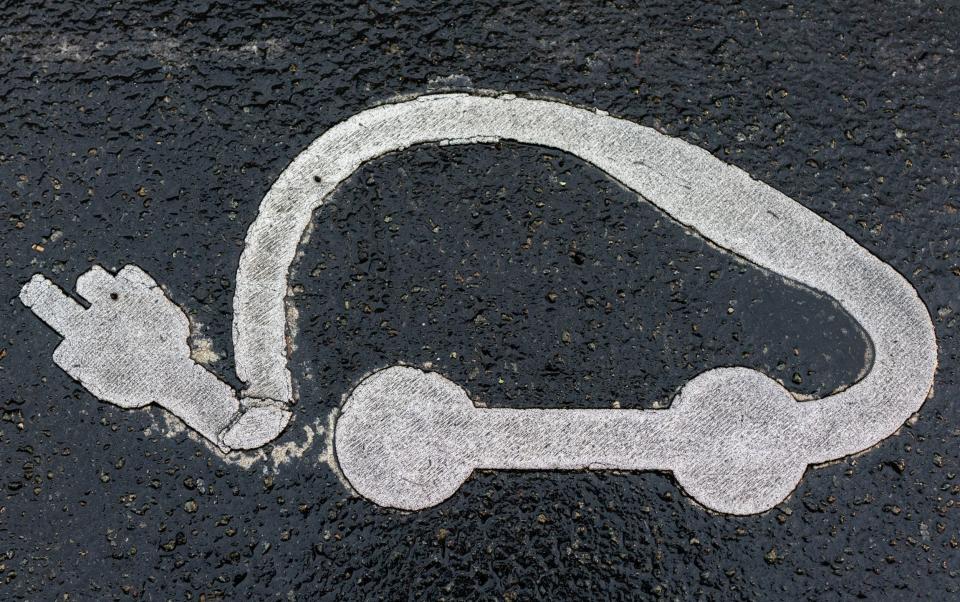 An electric car charging symbol