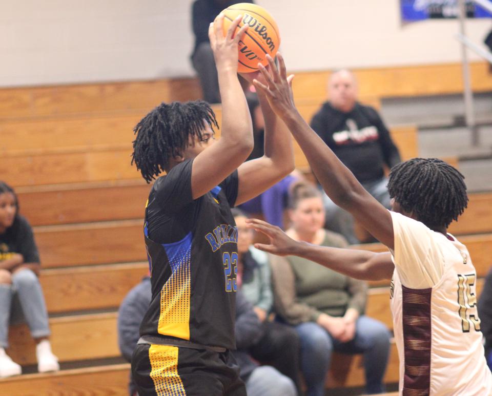 Richlands' Zarion Walters tries to get around Dixon's Messiah James on Wednesday.