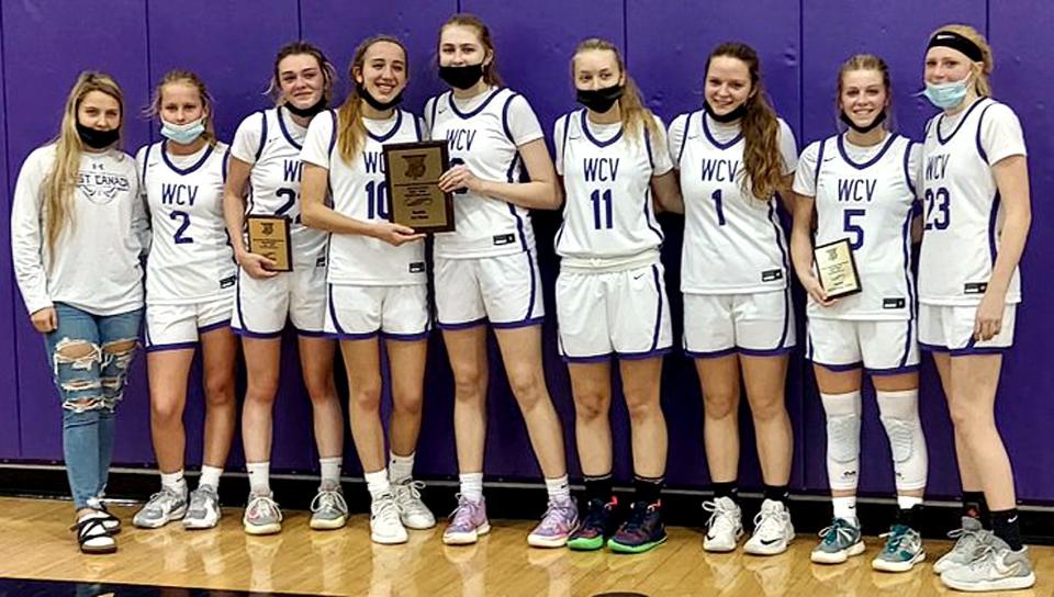 The West Canada Valley Indians pose with the championship plaque they earned by defeating Westmoreland Sunday in the West Canada Valley Sports Boosters Tip Off Tournament's championship game. Reese Fellows (third from left) and Olivia Morreale (5) holds their individual plaques.