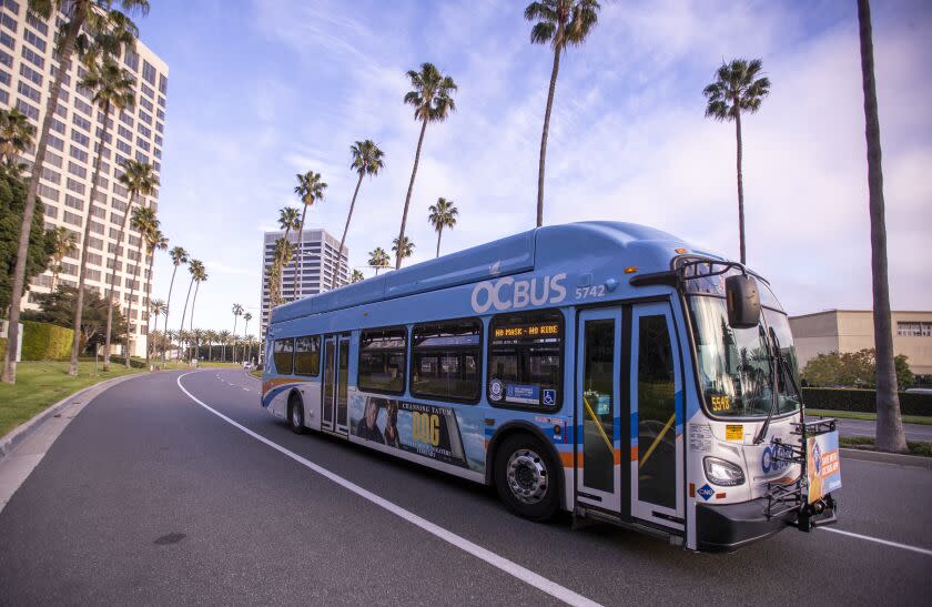 Newport Beach, CA - February 14: A bus driver drives an Orange County Transportation Authority bus. along its route in Newport Beach Monday, Feb. 14, 2022. Nearly 600 Orange County Transportation Authority (OCTA) bus drivers in Southern California are set to strike Tuesday, February 15, if negotiations with Teamsters Local 952 fail to produce an agreement before then. The previous contract expired almost a year ago, on April 30, 2021. (Allen J. Schaben / Los Angeles Times)