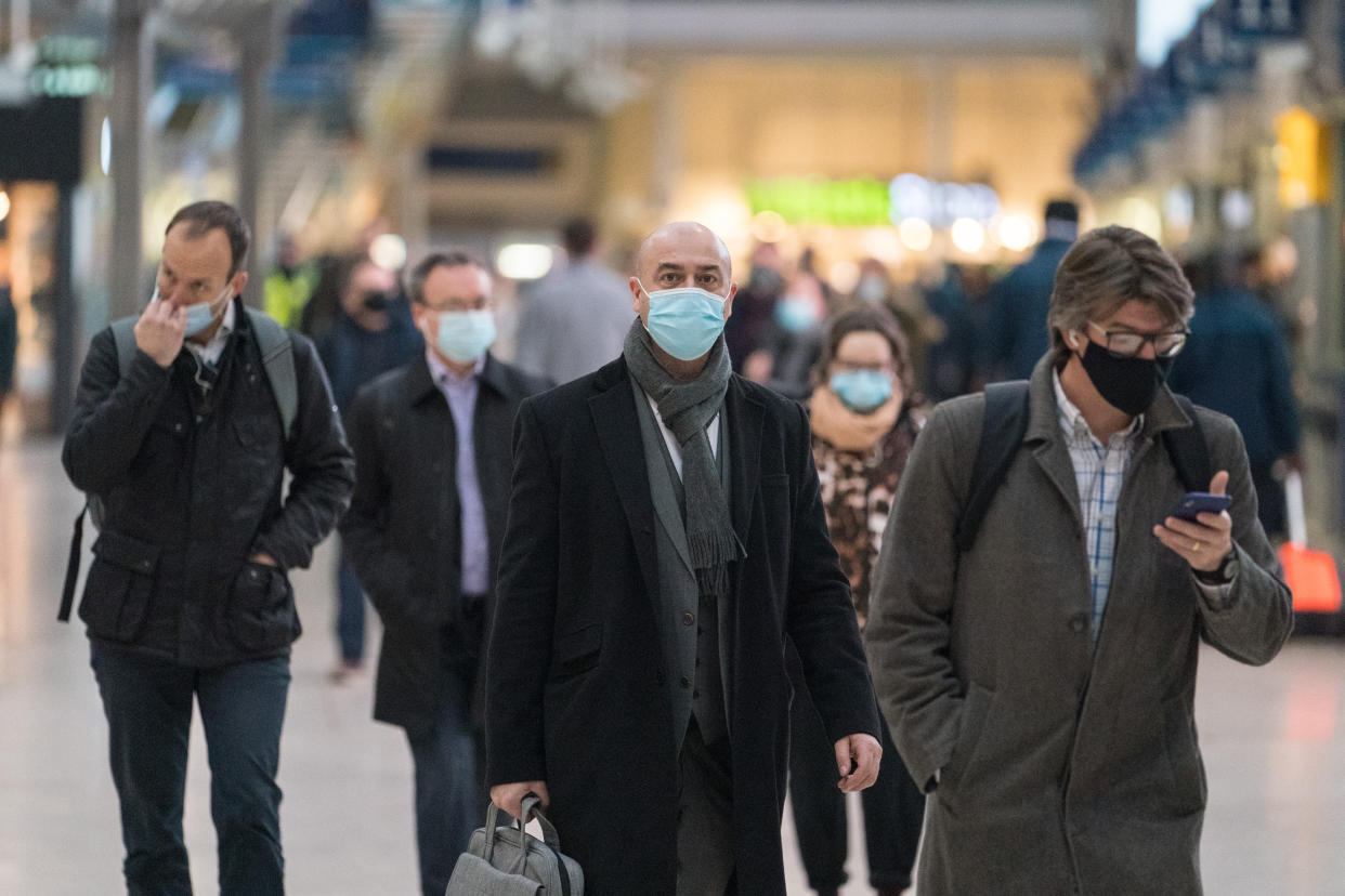 Commuters at Waterloo station, in London, as Plan B measures are lifted in England. Face coverings will no longer be mandatory in any setting, and the NHS Covid Pass will no longer be compulsory for entry into nightclubs and other large venues. Picture date: Thursday January 27, 2022.