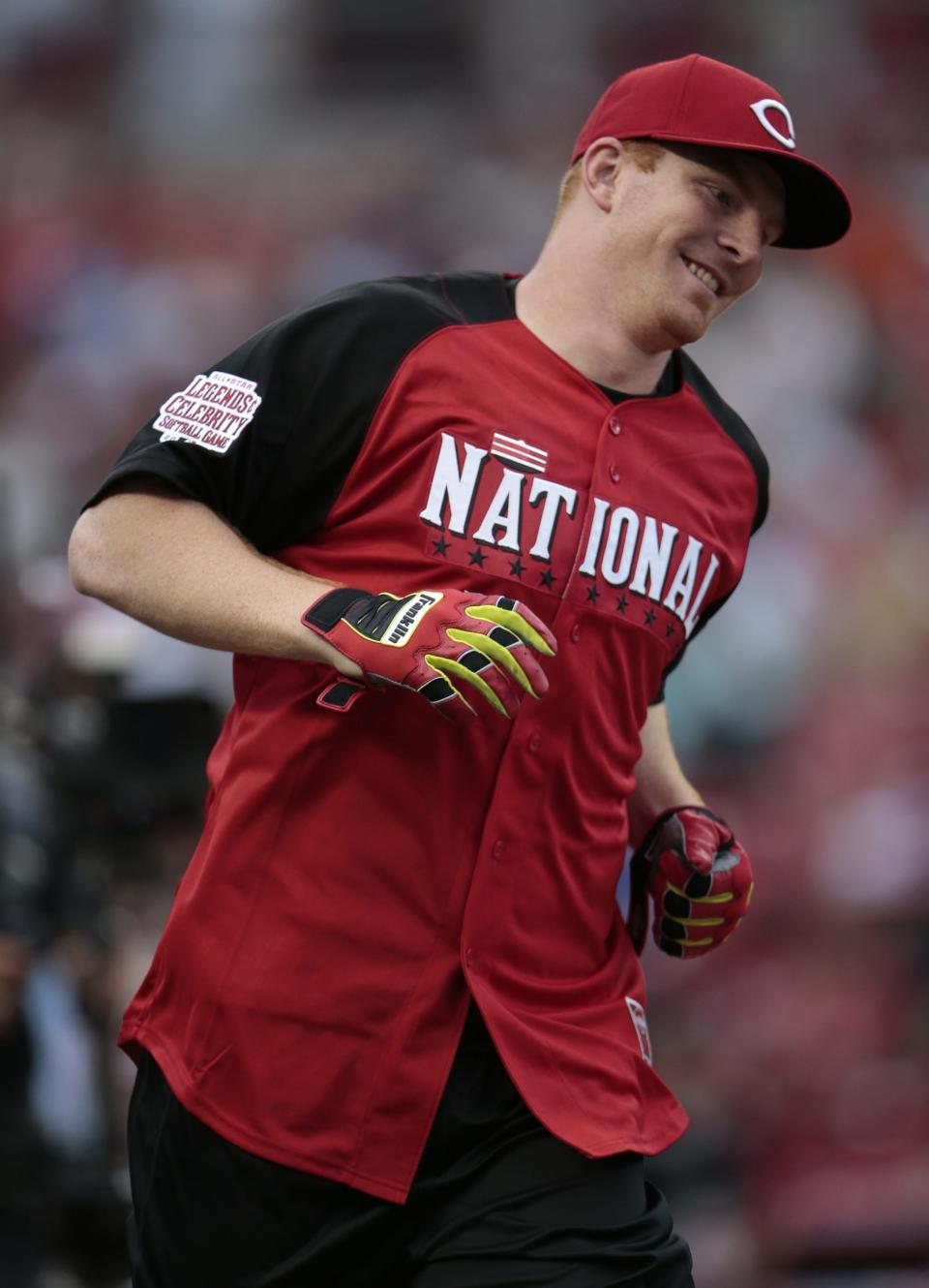 Andy Dalton rounds the bases on a home run during the Legends and Celebrity Softball Game at Great American Ballpark on Sunday, July 12, 2015.