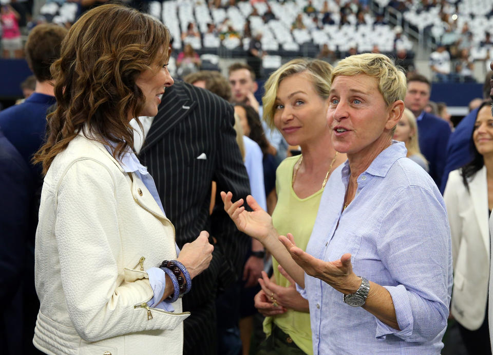 Ellen DeGeneres raised eyebrows when she was spotted siting next to George W. Bush at a Cowboys game. (Getty)