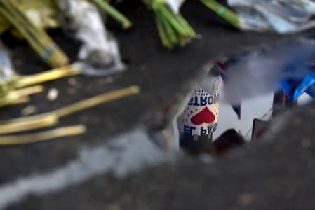 People pay their respects four days after a mass shooting in El Paso