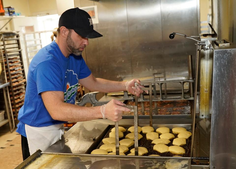 Daren Gallant of Adrian, production manger at Morning Fresh Bakeries, tends to the fryer while working on making several dozen paczki Monday afternoon.