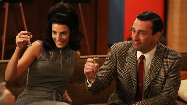 Don Draper (Jon Hamm) with second wife Megan Calvet (Jessica Paré) in <em>Mad Men</em>.