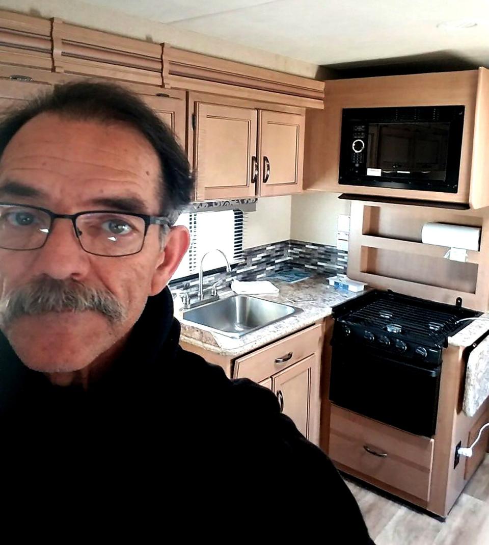 Reggie Dominguez in a trailer at Dockweiler Beach RV Park, where he's quarantining with what might be COVID-19.