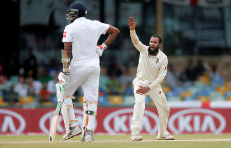 Cricket - England v Sri Lanka, Third Test - Colombo, Sri Lanka - November 24, 2018. England's Adil Rashid appeals for succesful LBW wicket for Sri Lanka's Malinda Pushpakumara (not pictured). REUTERS/Dinuka Liyanawatte