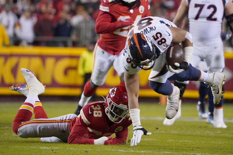 Denver Broncos tight end Albert Okwuegbunam (85) is stopped by Kansas City Chiefs cornerback L'Jarius Sneed (38) during the first half of an NFL football game Sunday, Dec. 5, 2021, in Kansas City, Mo. (AP Photo/Ed Zurga)