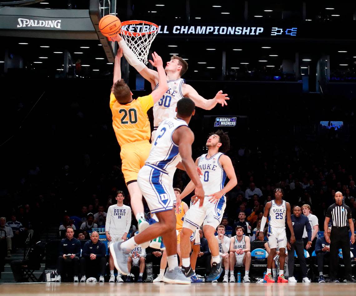 Duke’s Kyle Filipowski (30) blocks the shot by Vermont’s TJ Long (20) during Duke’s 64-47 victory over Vermont in the first round of the NCAA Tournament at the Barclays Center in Brooklyn, N.Y., Friday, March 22, 2024. Ethan Hyman/ehyman@newsobserver.com