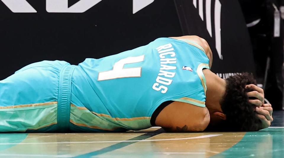 Charlotte Hornets center Nick Richards holds his head after being fouled by Milwaukee Bucks guard/forward Andre Jackson Jr.,during first half action on Friday, November 17, 2023. Richards sustained a concussion on the play.