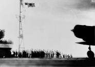 <p>The crew of the Japanese carrier Shokaku cry “banzai” as a Type 97 Kate carrier attack plane takes off as the second wave attack is launched on Pearl Harbor on Dec. 7, 1941. (U.S. Navy/National Archives/Handout via Reuters) </p>