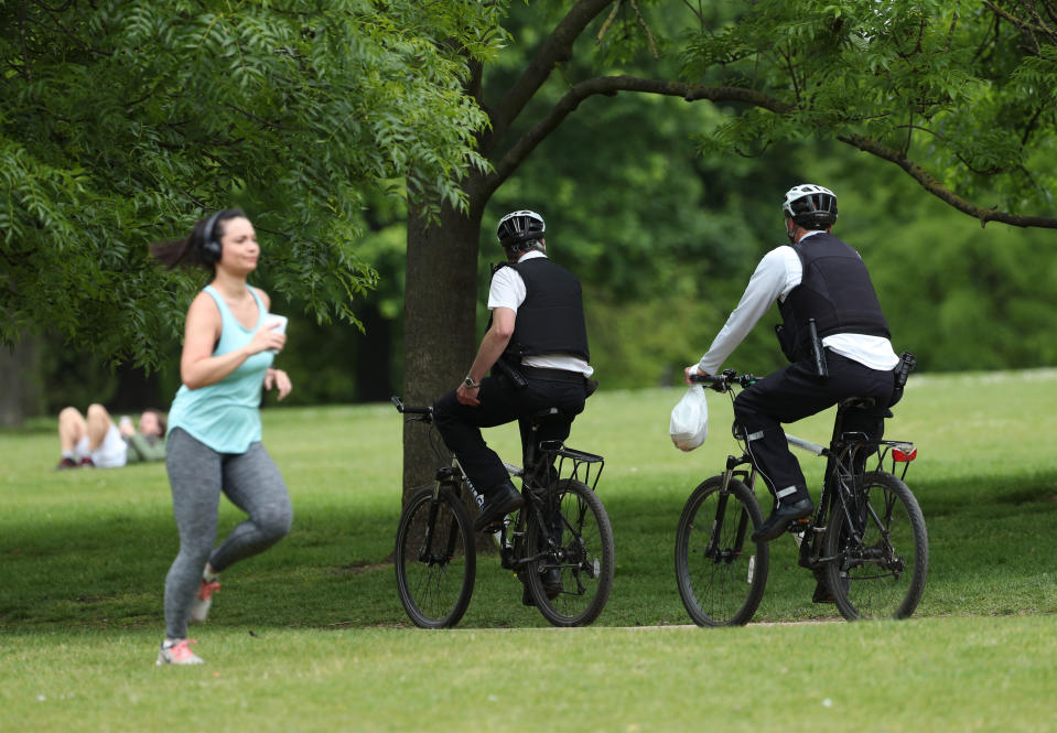 Police officers on bicycles on patrol in Hyde Park, London, as the UK continues in lockdown to help curb the spread of the coronavirus.