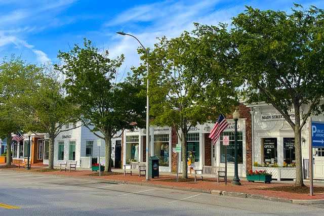 <p>Barry Winiker/Getty</p> A block featuring luxury stores in the Hamptons