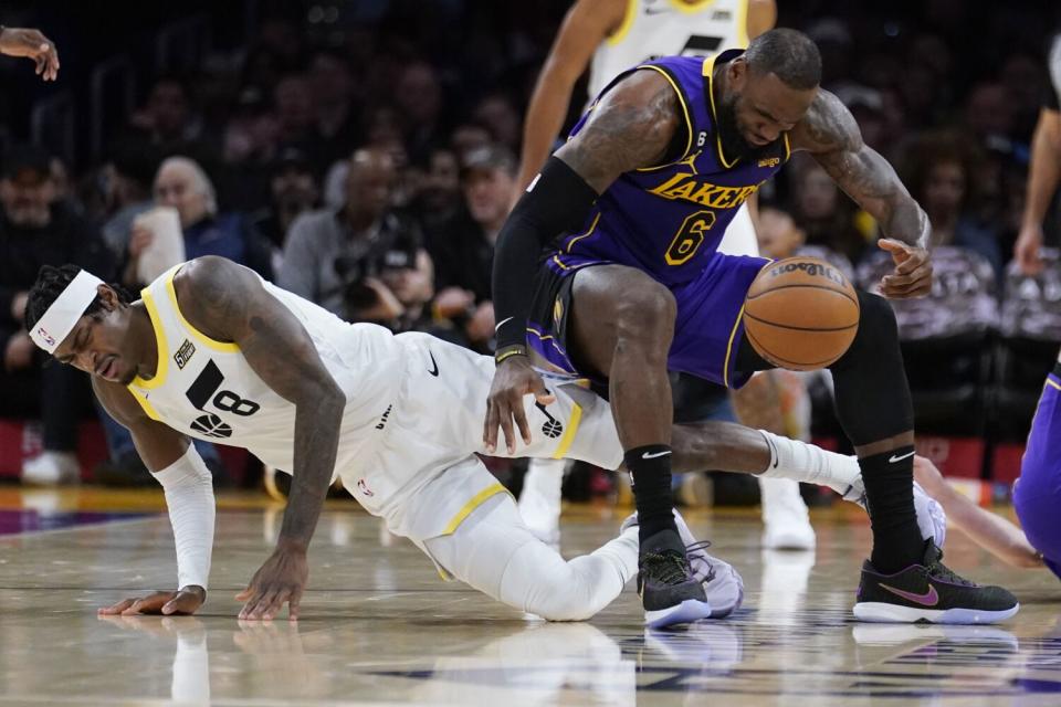 Los Angeles Lakers forward LeBron James (6) collides with Utah Jazz forward Jarred Vanderbilt.