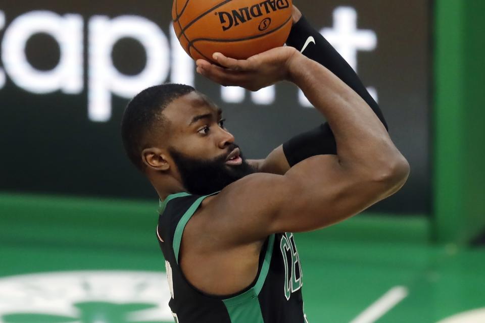 Boston Celtics' Jaylen Brown shoots during the second half of an NBA basketball game against the Cleveland Cavaliers, Sunday, Jan. 24, 2021, in Boston. (AP Photo/Michael Dwyer)