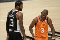 Los Angeles Clippers guard Paul George, left, tires to talk to Phoenix Suns guard Chris Paul during the second half in Game 3 of the NBA basketball Western Conference Finals Thursday, June 24, 2021, in Los Angeles. (AP Photo/Mark J. Terrill)