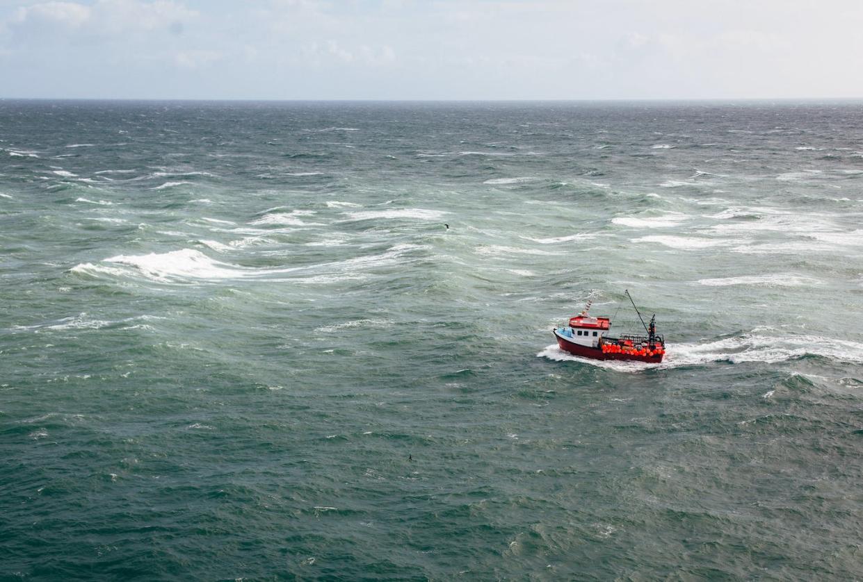 Many commercial fishing boats do not report their positions at sea or are not required to do so. <a href="https://www.gettyimages.com/detail/photo/aerial-view-of-small-fishing-boat-in-open-ocean-royalty-free-image/1285320085" rel="nofollow noopener" target="_blank" data-ylk="slk:Alex Walker via Getty Images;elm:context_link;itc:0;sec:content-canvas" class="link ">Alex Walker via Getty Images</a>