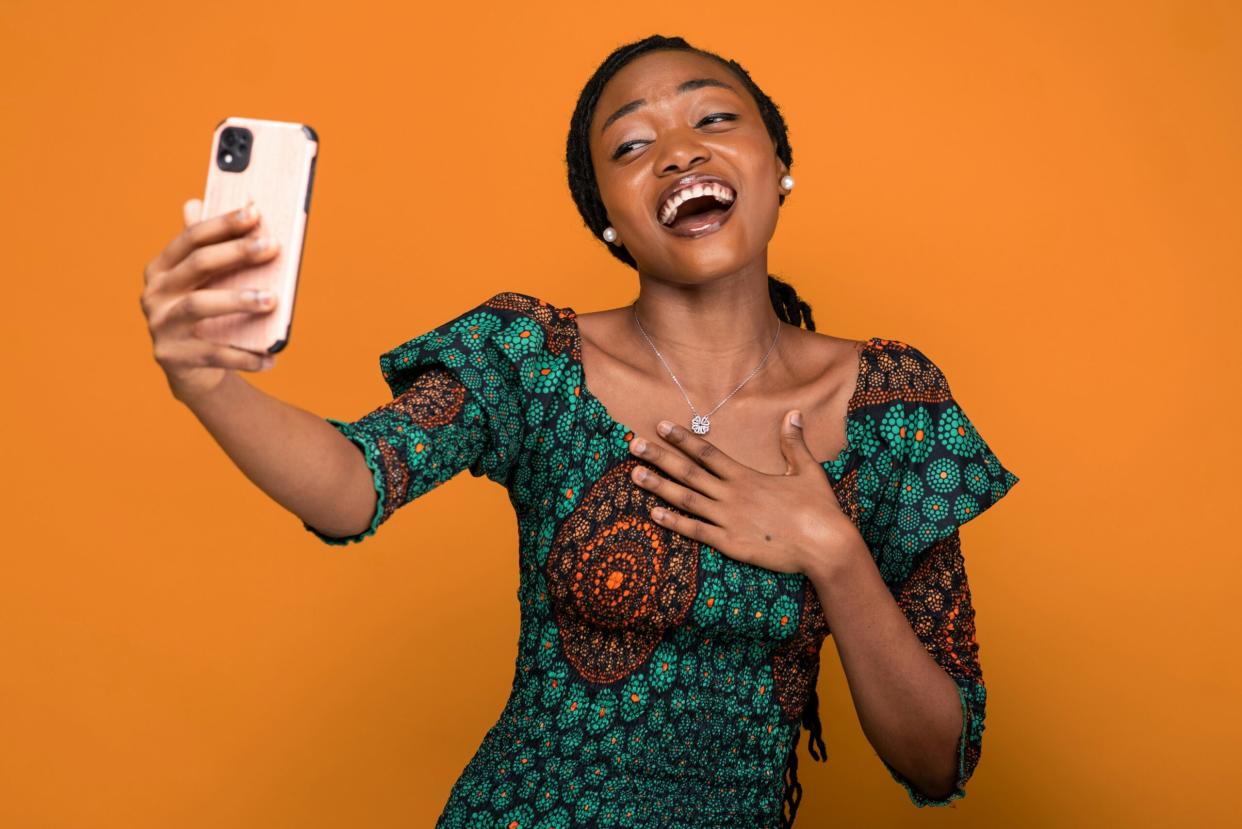 Millenial Pause x Gen Z Shake pictured: woman taking a selfie | Photo by Ahmed Nasiru/Unsplash