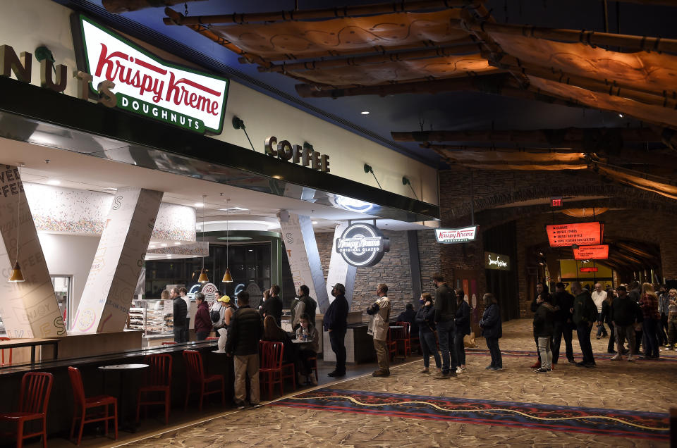 UNCASVILLE, CONNECTICUT - DECEMBER 19: People line up at the Krispy Kreme after the Basketball Hall of Fame Women&#39;s Showcase at Mohegan Sun Arena on December 19, 2021 in Uncasville, Connecticut. (Photo by G Fiume/Getty Images)