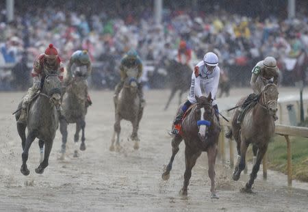 May 5, 2018; Louisville, KY, USA; Mike Smith aboard Justify (7) races Javier Castellano aboard Audible (5) during the 144th running of the Kentucky Derby at Churchill Downs. Mandatory Credit: Brian Spurlock-USA TODAY Sports