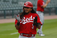 Cincinnati Reds' Freddy Galvis celebrates after scoring against the Detroit Tigers in the seventh inning of the first baseball game of a doubleheader in Detroit, Sunday, Aug. 2, 2020. (AP Photo/Paul Sancya)
