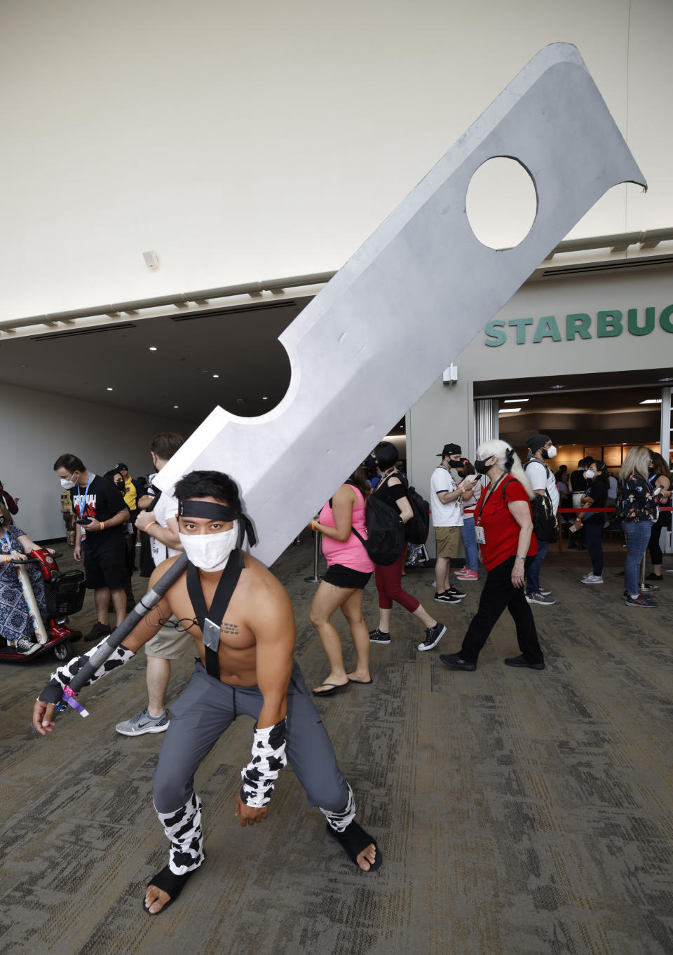 Tristan Moreno, of Santa Clarita, Calif., dressed as Zabuza Momochi from "Naruto" attends day two of Comic-Con International on Friday, July 22, 2022, in San Diego. (Photo by Christy Radecic/Invision/AP)
