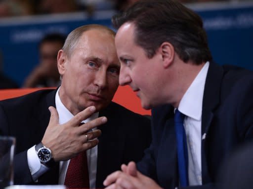 Russia's President Vladimir Putin (L) and British Prime Minister David Cameron (R) watch the judo at the London Olympics. Russian President Vladimir Putin and British premier David Cameron failed to hide their differences on the Syrian crisis on Thursday before the two leaders watched the Olympic judo together