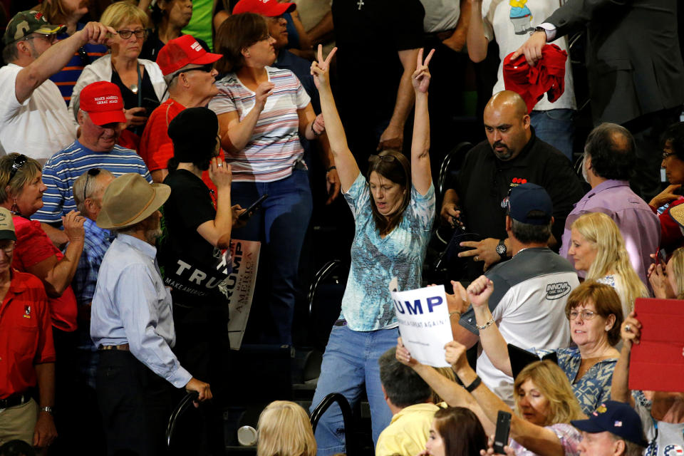 <p>Police remove a protester during a rally by Republican presidential candidate Donald Trump and his supporters in Albuquerque, N.M., on May 24, 2016. (Reuters/Jonathan Ernst) </p>