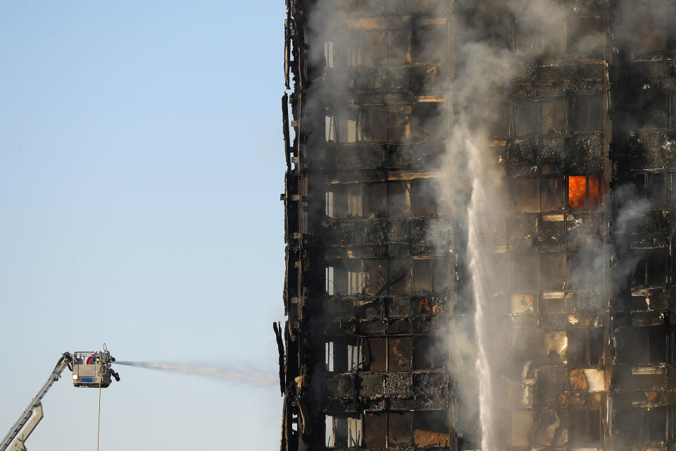 <p>Firefighters deal with a serious fire in a tower block at Latimer Road in West London, Britain June 14, 2017. (Toby Melville/Reuters) </p>