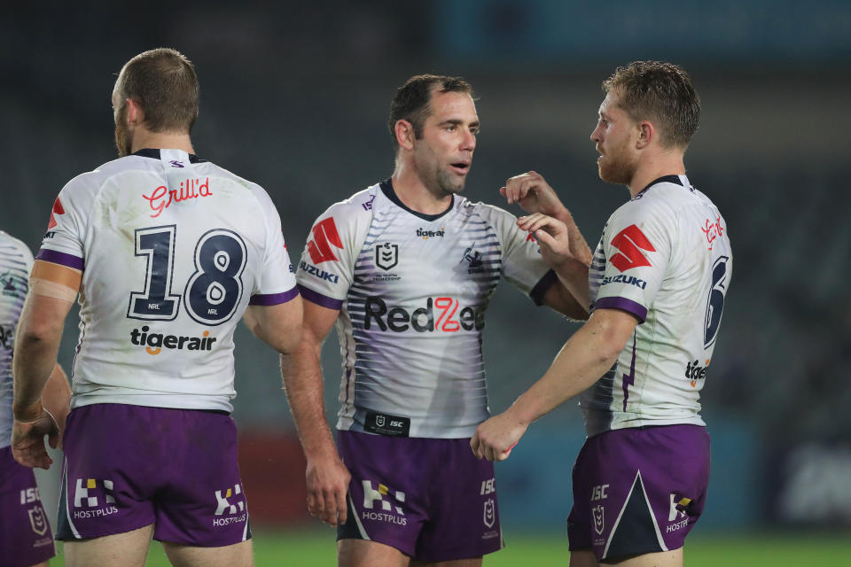 Cameron Smith (L) of the Storm celebrates with Cameron Munster (R).