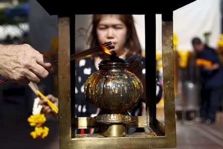 People pray at Erawan Shrine, the site of the recent bomb blast, in Bangkok August 30, 2015. REUTERS/Jorge Silva