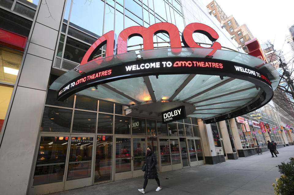 A pedestrian walks by the newly reopened AMC 34th Street theater on March 5, 2021, in New York. AMC Theatres says it will have 98% of its U.S. movie theaters open on Friday, with more expected to open by March 26. Shares of AMC Entertainment Holdings Inc. are up more than 4% before the market open on Thursday. (Photo by Evan Agostini/Invision/AP)