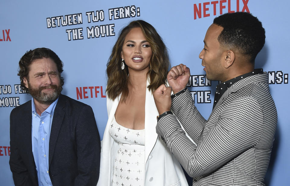 Zach Galifianakis, from left, Chrissy Teigen and John Legend arrive at the Los Angeles premiere of "Between Two Ferns: The Movie" at ArcLight Hollywood on Monday, Sept. 16, 2019. (Photo by Jordan Strauss/Invision/AP)