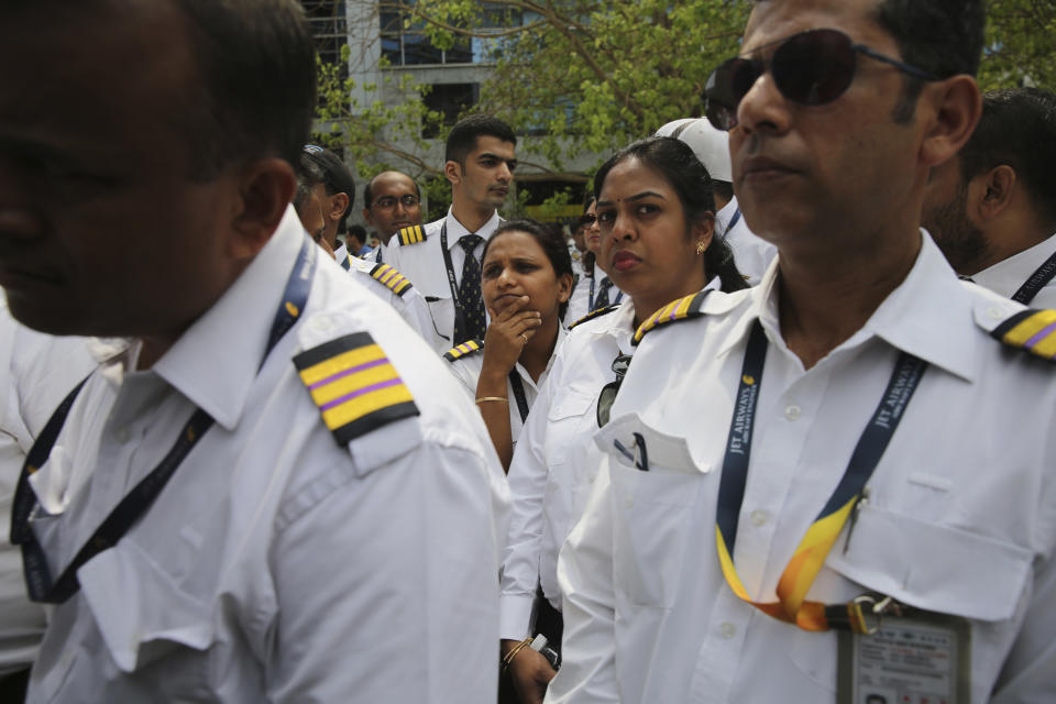 Employees of Jet Airways gather to demand clarification on unpaid salaries at Jet Airways headquarters in Mumbai, India, Monday, April 15, 2019. India's ailing Jet Airways has drastically reduced operations amid talks with investors to purchase a controlling stake in the airline and help it reduce its mounting debt. (AP Photo/Rafiq Maqbool)