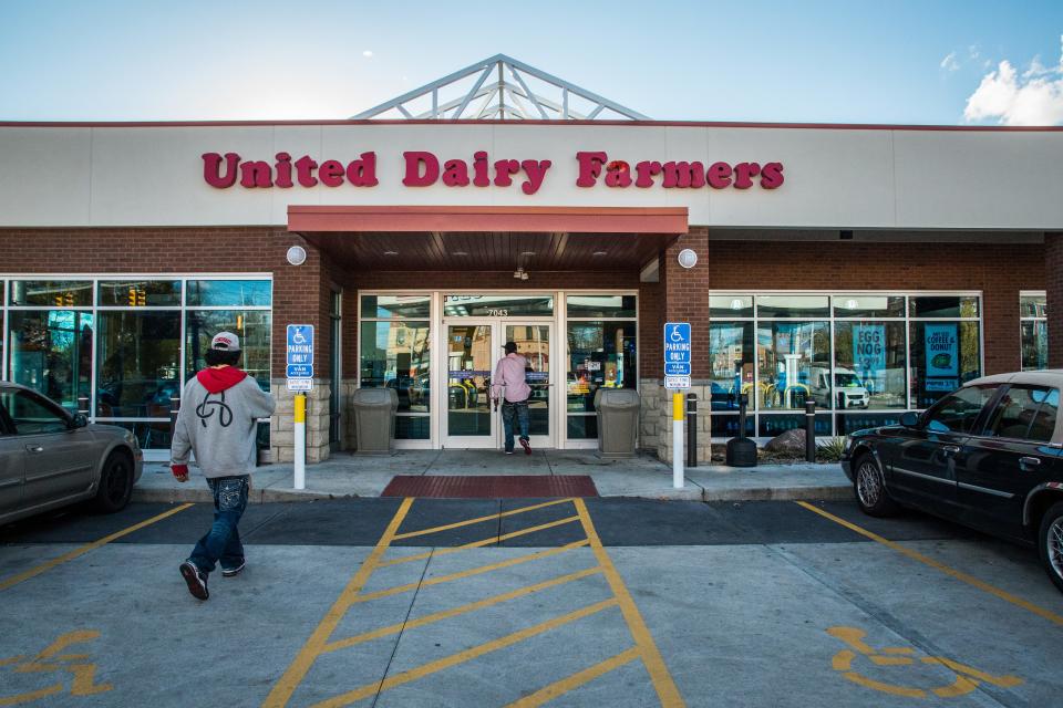 Customers walk in and out of the United Dairy Farmers' Silverton store. The Norwood-based company, founded in 1940, has more than 180 stores.