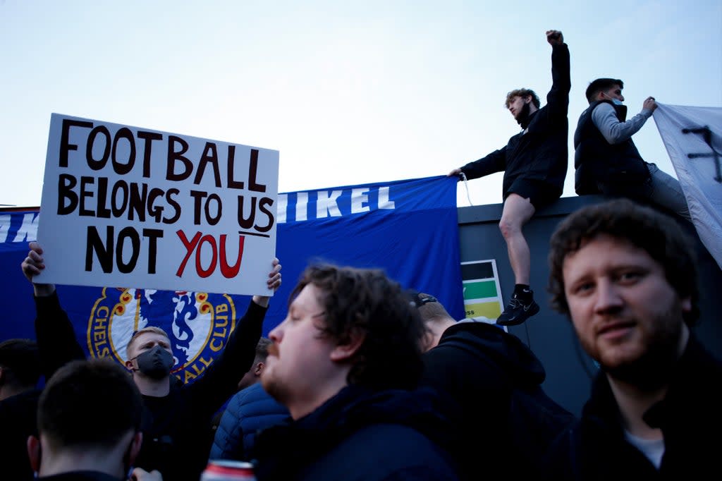 Fans protest the European Super League in April  (Anadolu Agency via Getty Images)