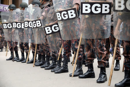 FILE PHOTO: Members of Border Guards Bangladesh stand guard during a protest over recent traffic accidents that killed a boy and a girl, in Dhaka, August 5, 2018. REUTERS/Mohammad Ponir Hossain