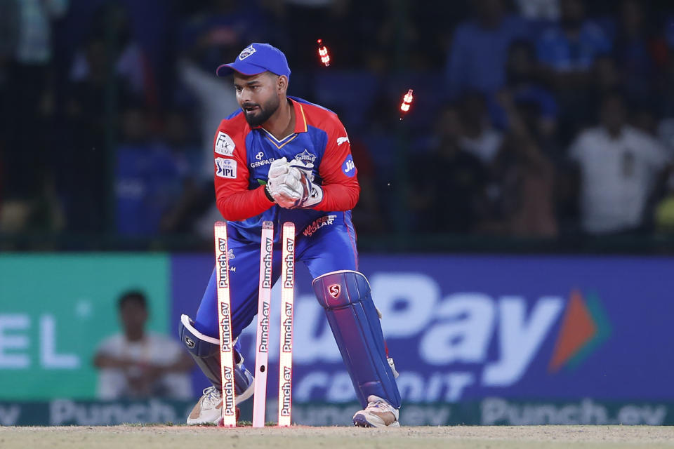 Delhi Capitals' captain Rishabh Pant removes the bails to run Mumbai Indians' Tilak Varma out during the Indian Premier League cricket match between Delhi Capitals and Mumbai Indians in New Delhi, India, Saturday, April 27, 2024. (AP Photo/ Surjeet Yadav)