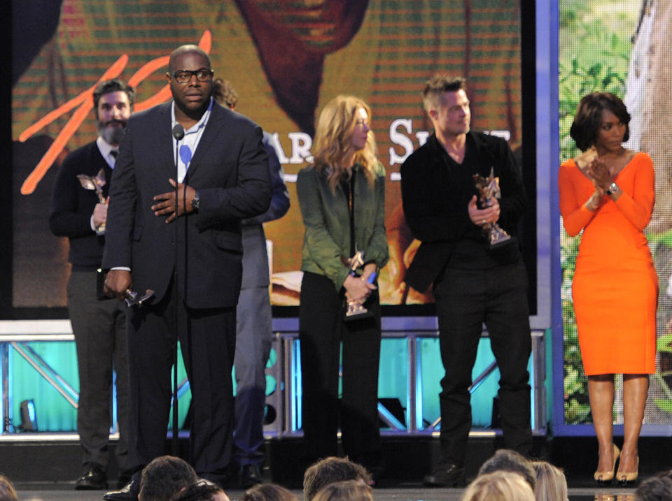 Steve McQueen, second from left, accepts the best feature award for "12 Years a Slave" along with, from left, Anthony Katagas, Dede Gardner, Brad Pitt and Angela Bassett on stage at the 2014 Film Independent Spirit Awards, on Saturday, March 1, 2014, in Santa Monica, Calif. (Photo by Chris Pizzello/Invision/AP)