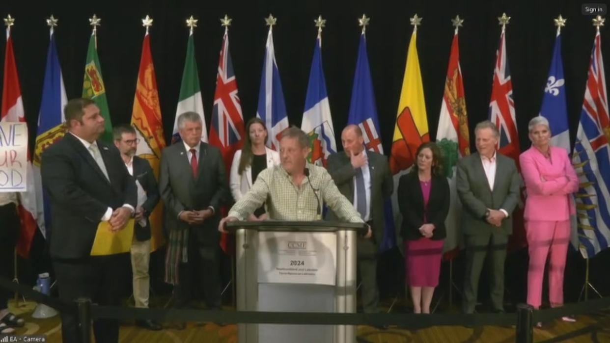 St. John's fish harvester Glen Winslow took to the microphone at a federal news conference Wednesday to voice his concerns over the federal government's decision to reopen the commercial cod fishery in Newfoundland and Labrador. (CBC - image credit)