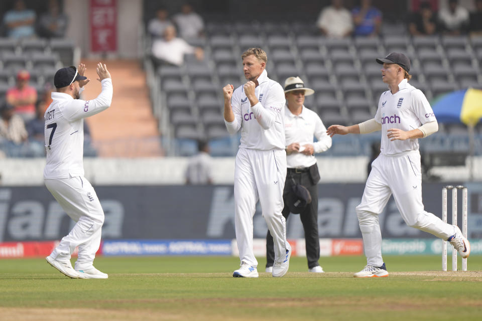 England's Joe Root, center, celebrates the wicket of India's Ravindra Jadeja on the third day of the first cricket test match between England and India in Hyderabad, India, Saturday, Jan. 27, 2024. (AP Photo/Mahesh Kumar A.)