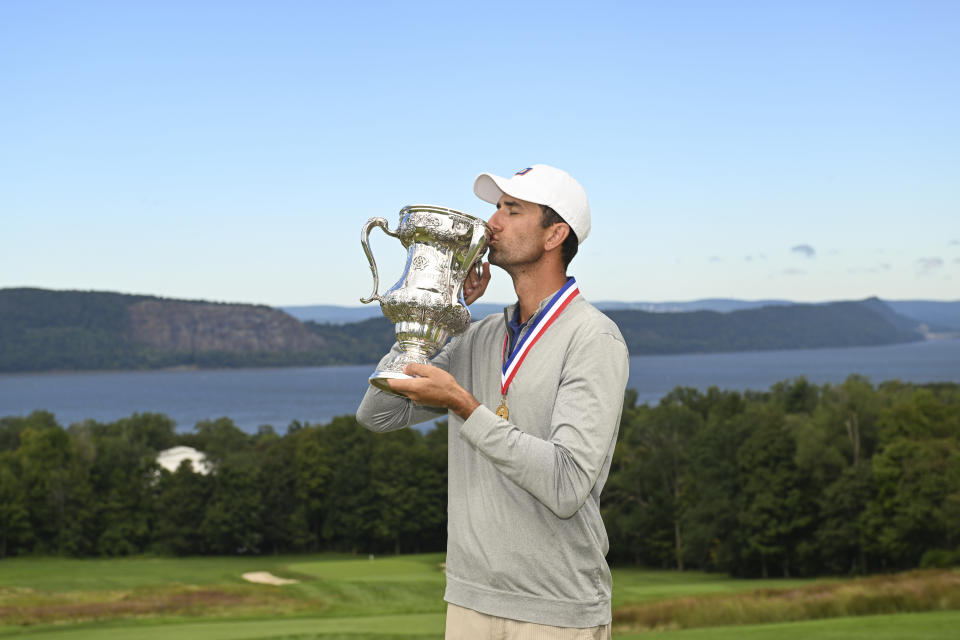 Stewart Hagestad kisses the Robert T. Jones, Jr. Memorial Trophy after winning the 2023 U.S. Mid-Amateur at Sleepy Hollow Country Club in Scarborough, N.Y. on Friday, Sept. 15, 2023. (Kathryn Riley/USGA)