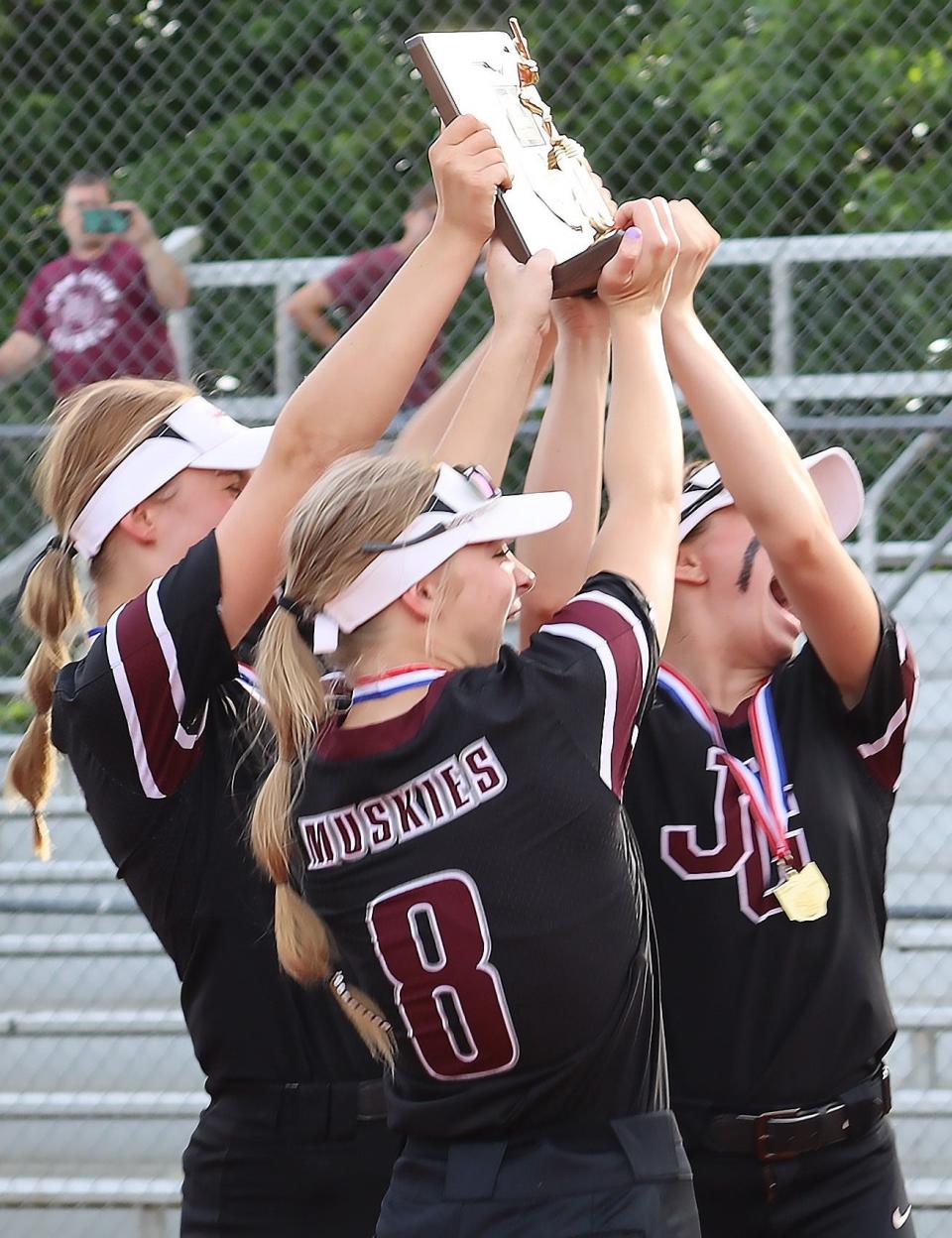John Glenn players celebrate their district title after topping Morgan 4-0 in the Division II district finals on Thursday.