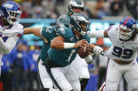 Philadelphia Eagles quarterback Jalen Hurts runs the ball during the first half of an NFL football game against the New York Giants, Sunday, Nov. 28, 2021, in East Rutherford, N.J. (AP Photo/John Munson)