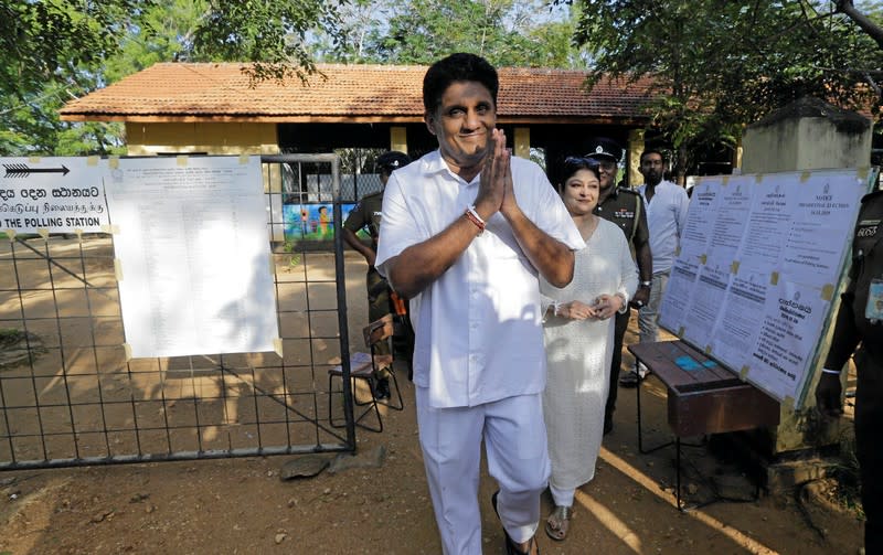 Premadasa, Sri Lanka's presidential candidate of the ruling United National Party led New Democratic Front alliance gesture as he leaves after casting his vote during the presidential election in Weerawila