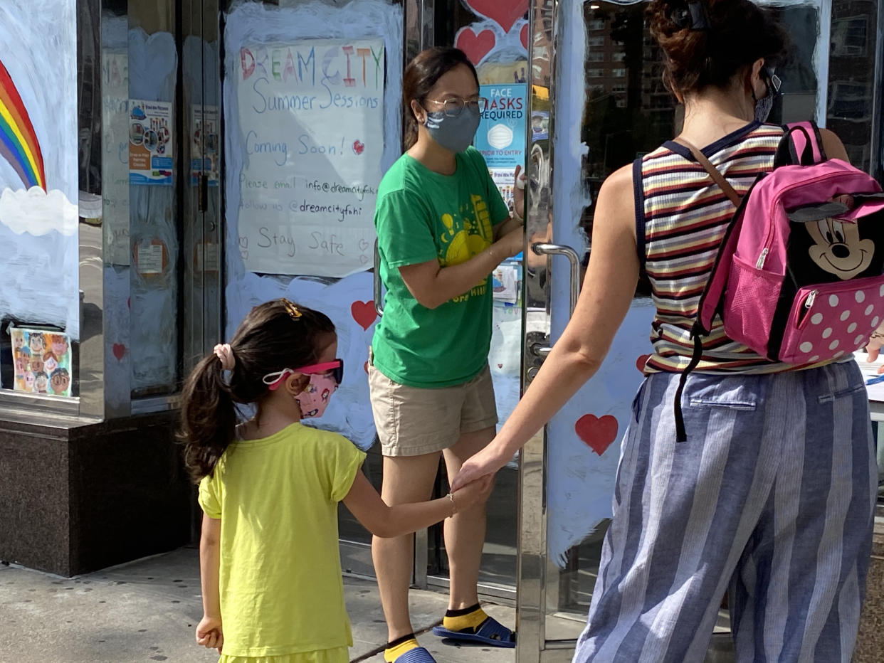 More childcare options pick back up, as shown by this day care drop-off during the phase 4 reopening in Queens, New York. (Photo by: Lindsey Nicholson/Education Images/Universal Images Group via Getty Images)