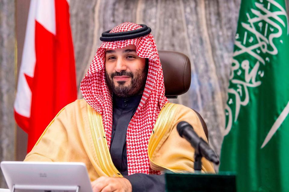 A handout picture provided by the Saudi Royal Palace on Dec. 24, 2020 shows Saudi Crown Prince Mohammed bin Salman attending by videoconference a meeting with Bahrain's Crown Prince of the Saudi-Bahraini Coordinating Council.